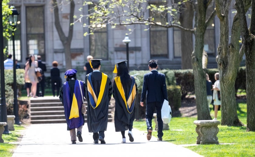 Graduates walking on campus