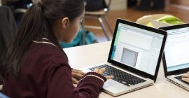 student at laptop studying