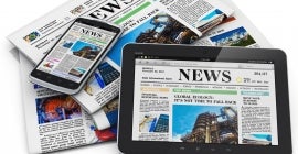 newspapers and e-readers with headlines