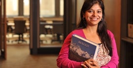 Student holding a textbook